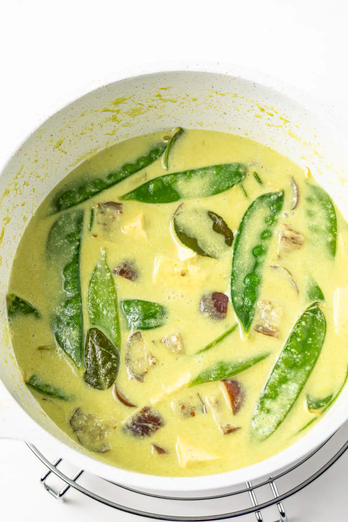 Thai green curry in a saucepan.