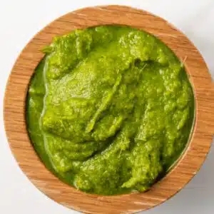 Thai green curry paste in a wooden bowl.