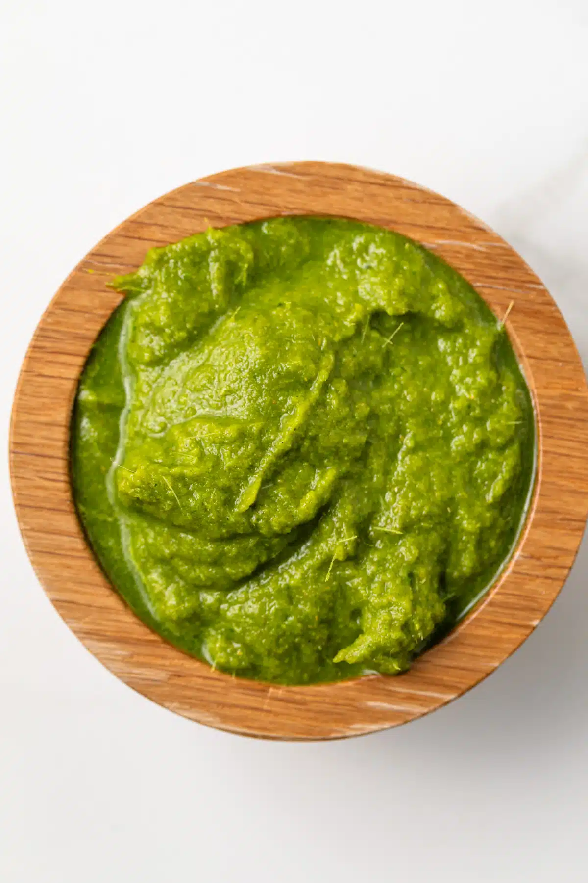 Thai green curry paste in a wooden bowl.