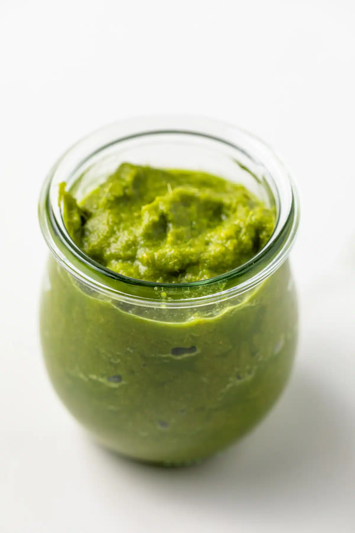 Thai green curry paste in a glass jar.