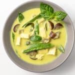 Thai green curry in a gray bowl.