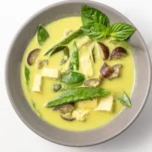 Thai green curry in a gray bowl.