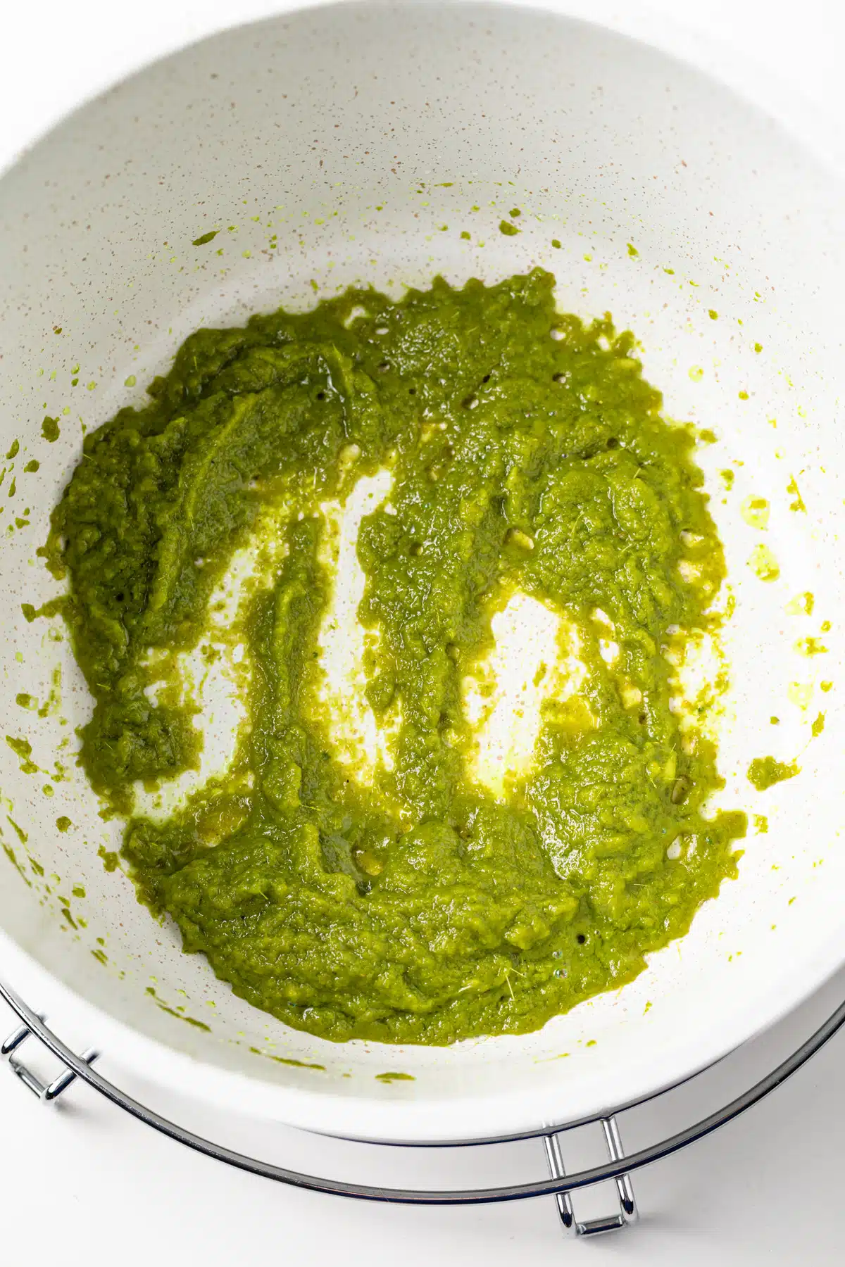 Sauteed curry paste in a saucepan.
